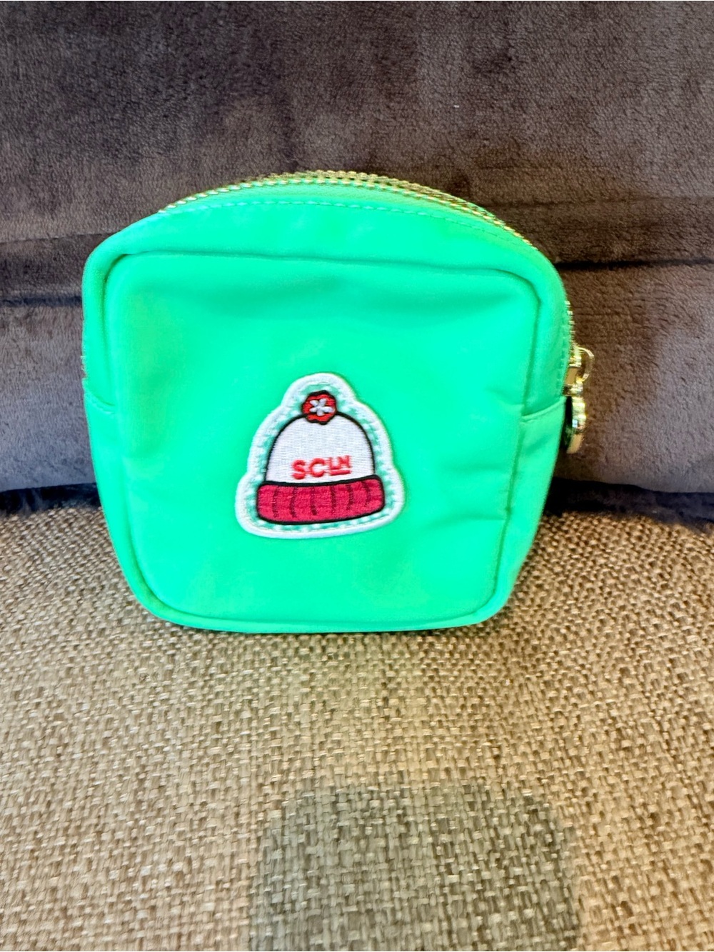 Stoney clover lane mini avocado pouch with hat patch sewn on.